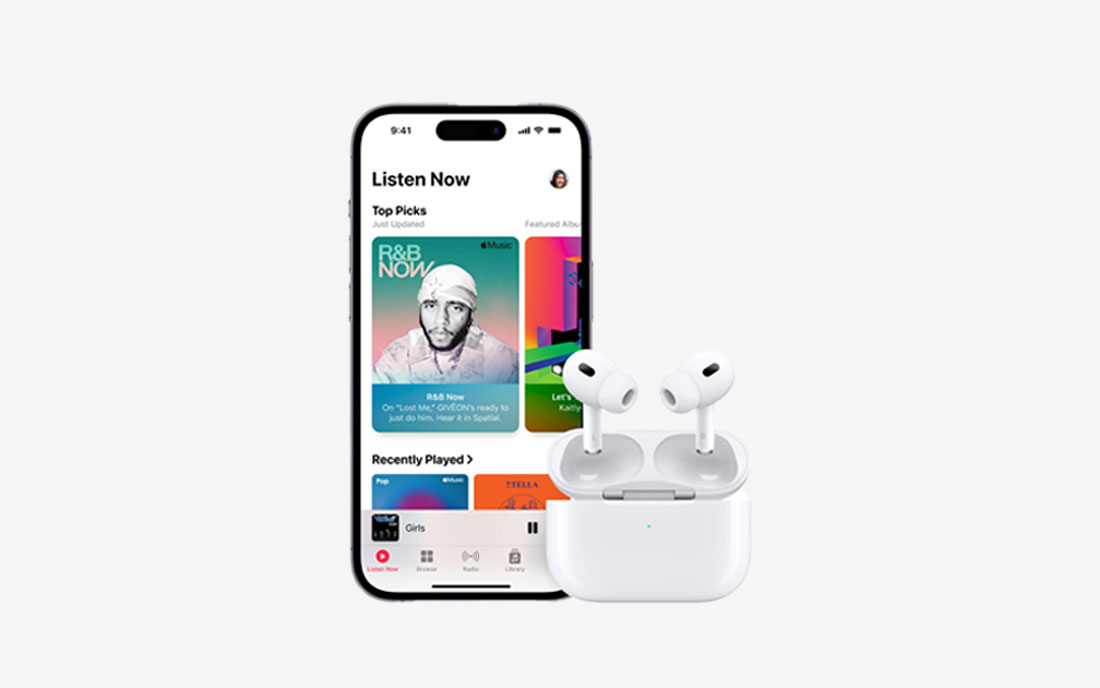 Apple iPhone with music app displayed next to white headphone plugs with charging case