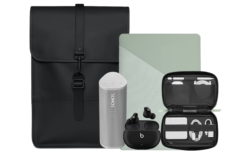 Mac accessories black backpack, green sleeve, small grey speaker and orange external harddrive